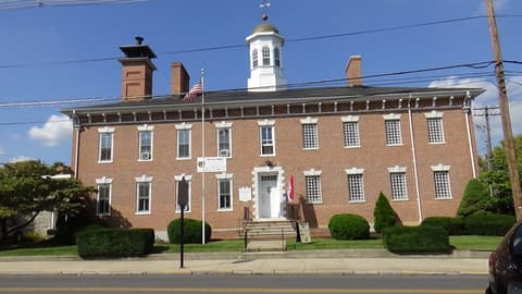 Front elevation of the 1818 Old Franklin County Jail with its white cupola